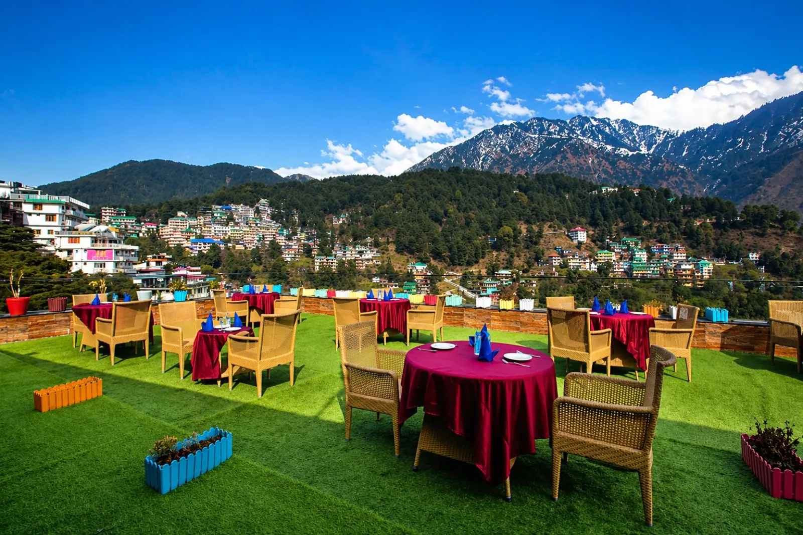 Rooftop dining at The Signature Inn with panoramic Dhauladhar views